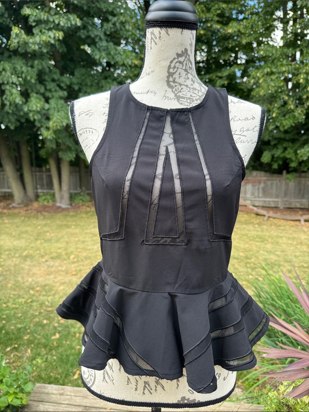 AKIRA Black Sleeveless Top with Peplum Hem
